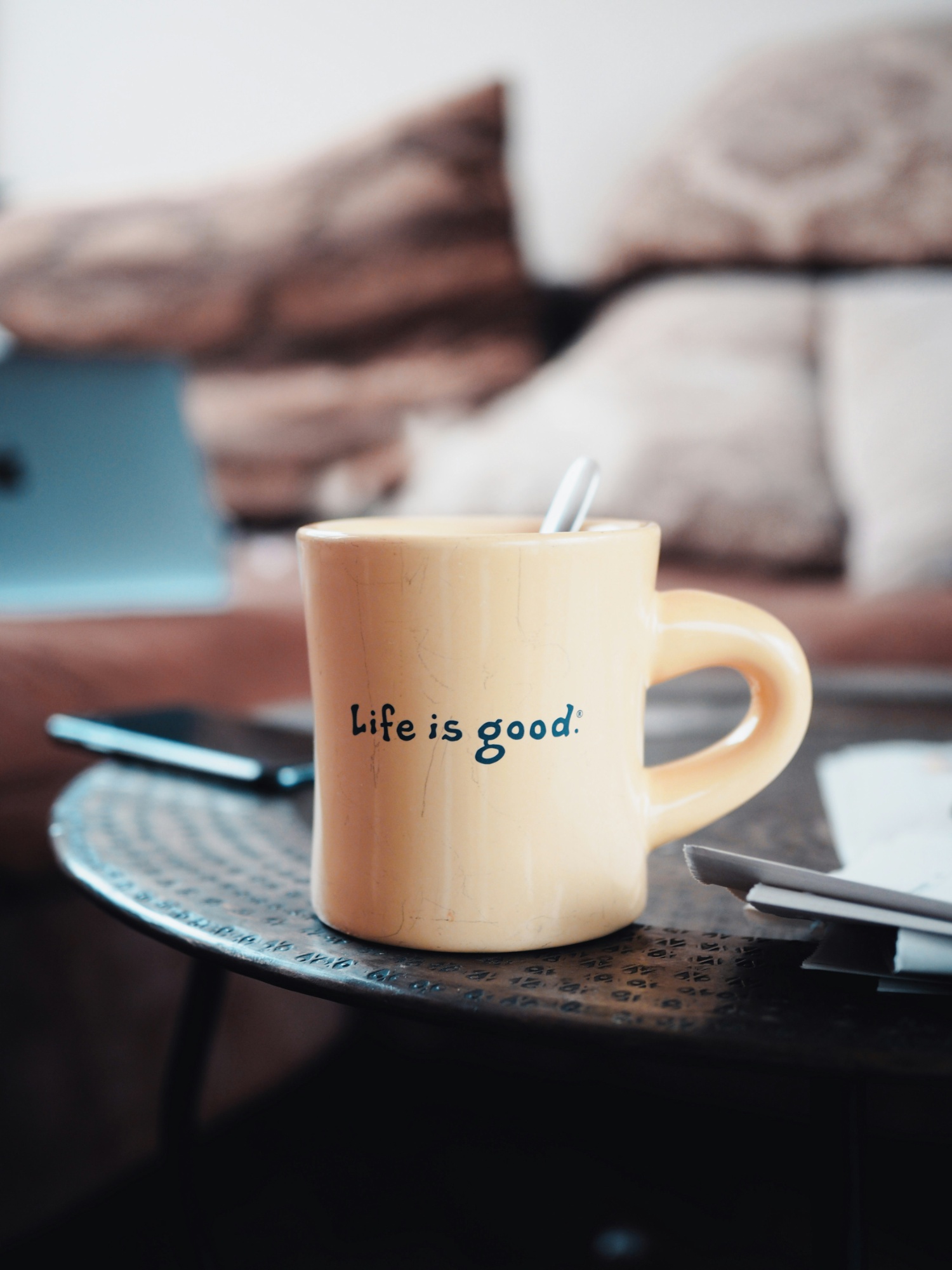 White coffee mug  with "life is good" written on it