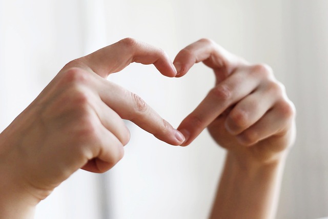 Fingers forming a heart shape