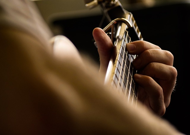 Person playing a guitar