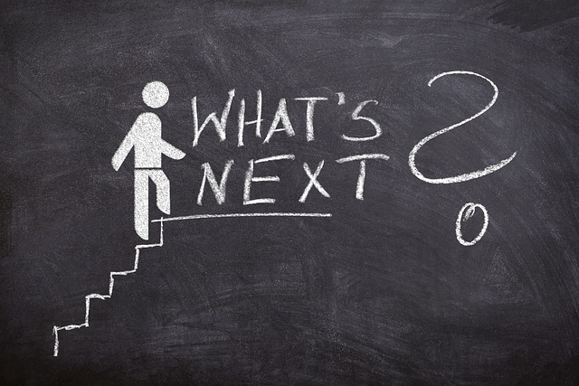 Blackboard picture of person climbing stairs with what's next and a question mark